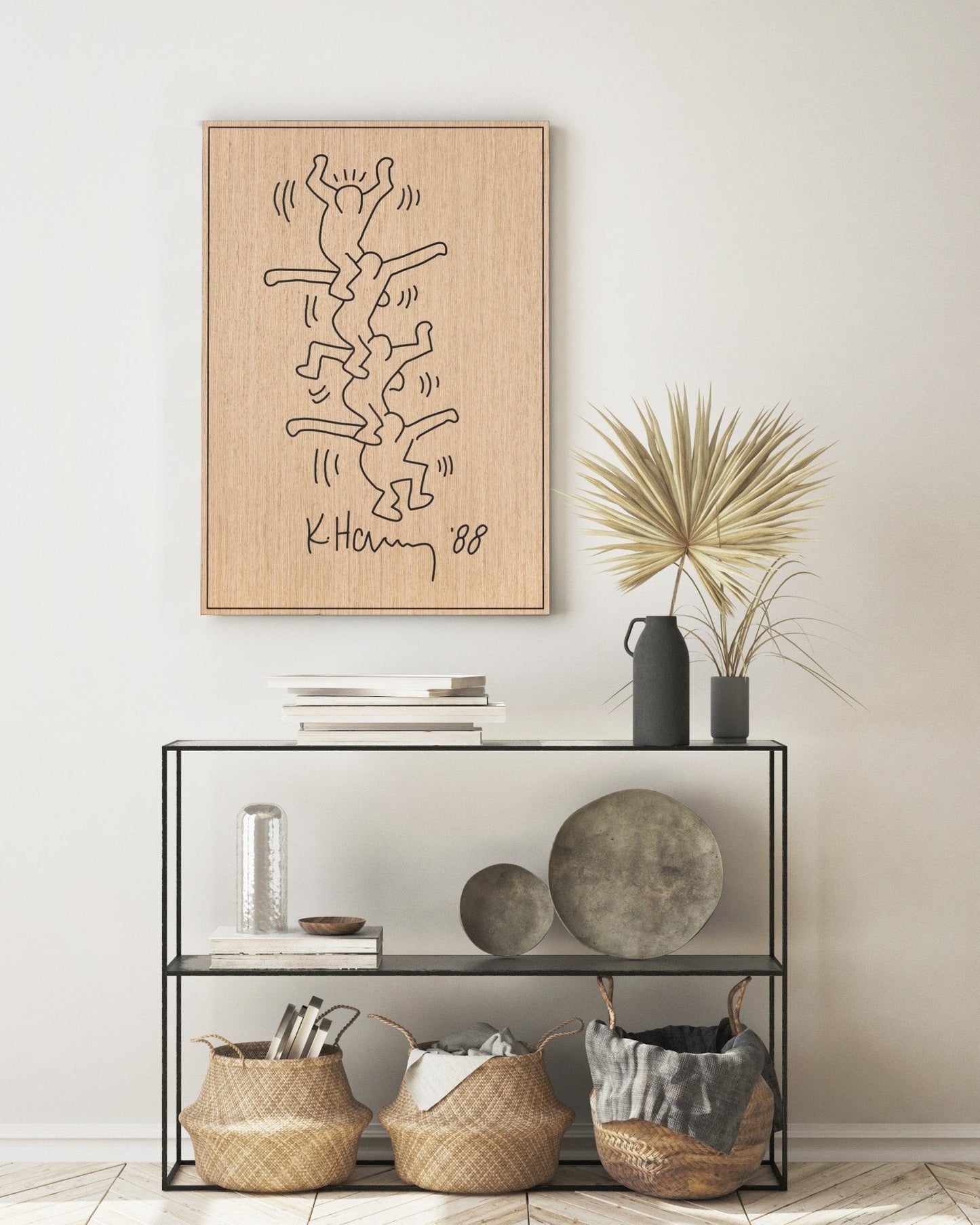 Carved oak and black wood wall panel inspired by Keith Haring, styled above a console table
