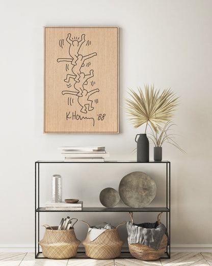 Carved oak and black wood wall panel inspired by Keith Haring, styled above a console table