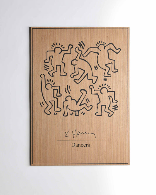 The Dancers Keith Haring oak and black carved wall panel, front view on white background