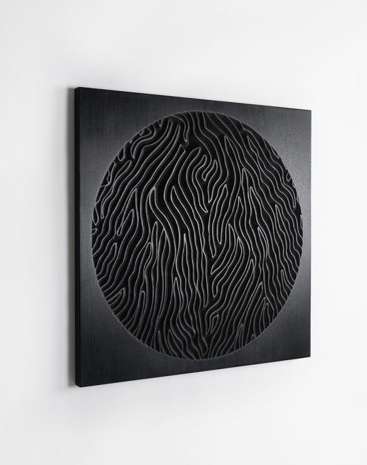 The Desert Planet black ash wall sculpture, front view of the circular carved relief