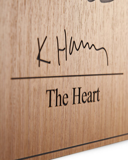 Edge detail of matte finish and carved transition between oak and black relief