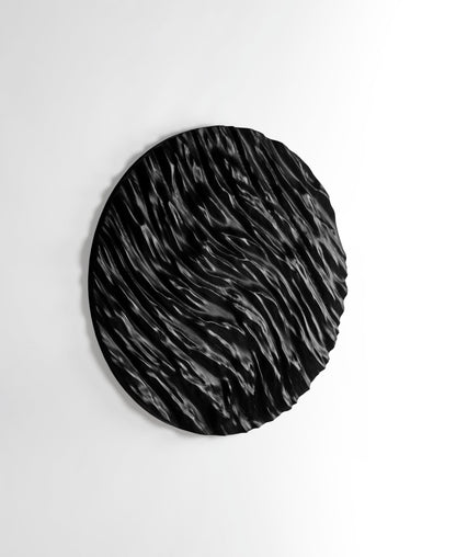 Tight focus on carved ocean ridges in black wood, ideal for new home gift ideas and refined interior decoration aesthetics