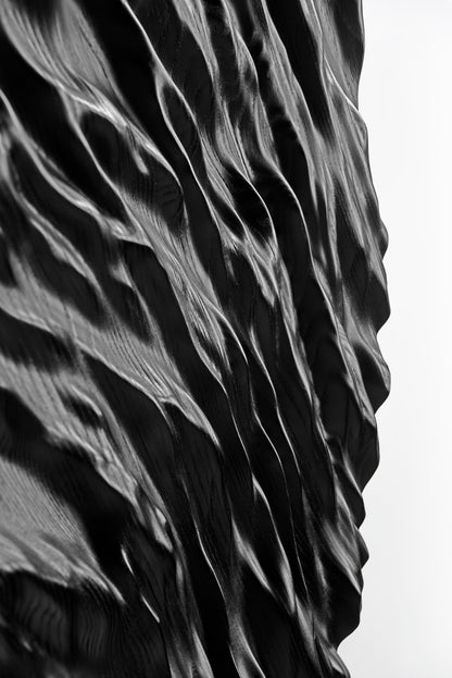 Smooth edge highlighting the black wood’s subdued grain, merging boho chic interior appeal with a crisp geometric design motif.