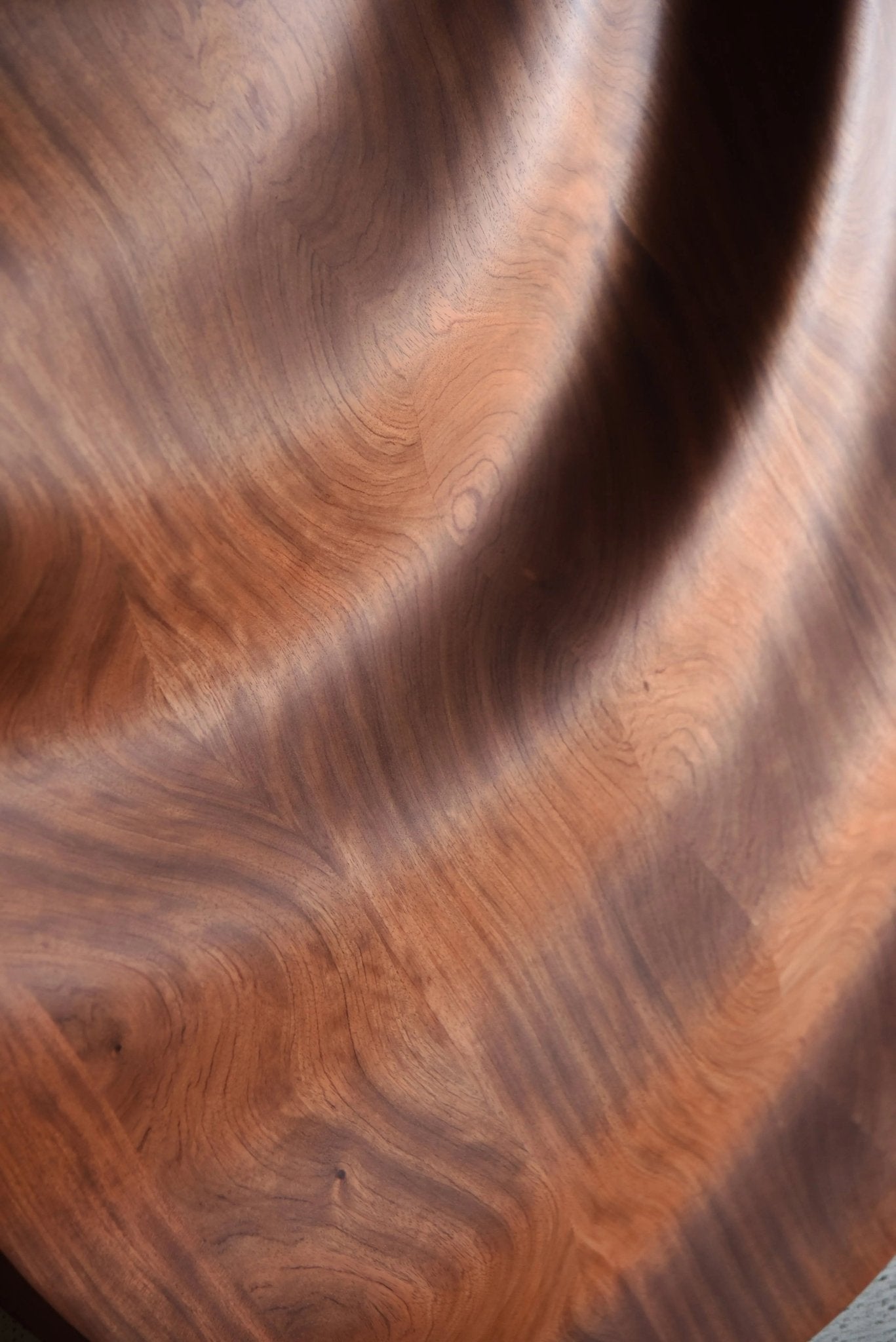 Close-up showing carved wave ridges in bubinga, uniting big wall decor ambition with flowing geometry art detailing in each sculpted groove.