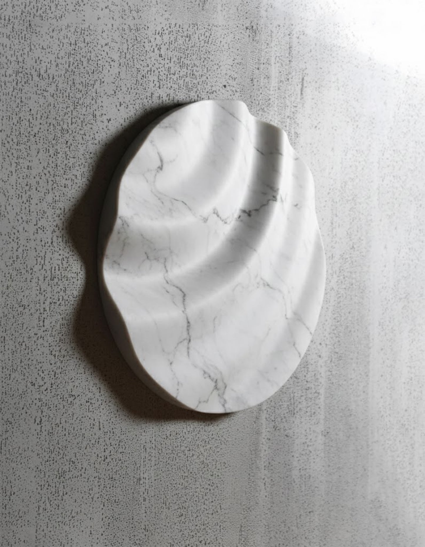 Wave Carrara marble wall sculpture on a textured wall, showing soft relief and natural veining