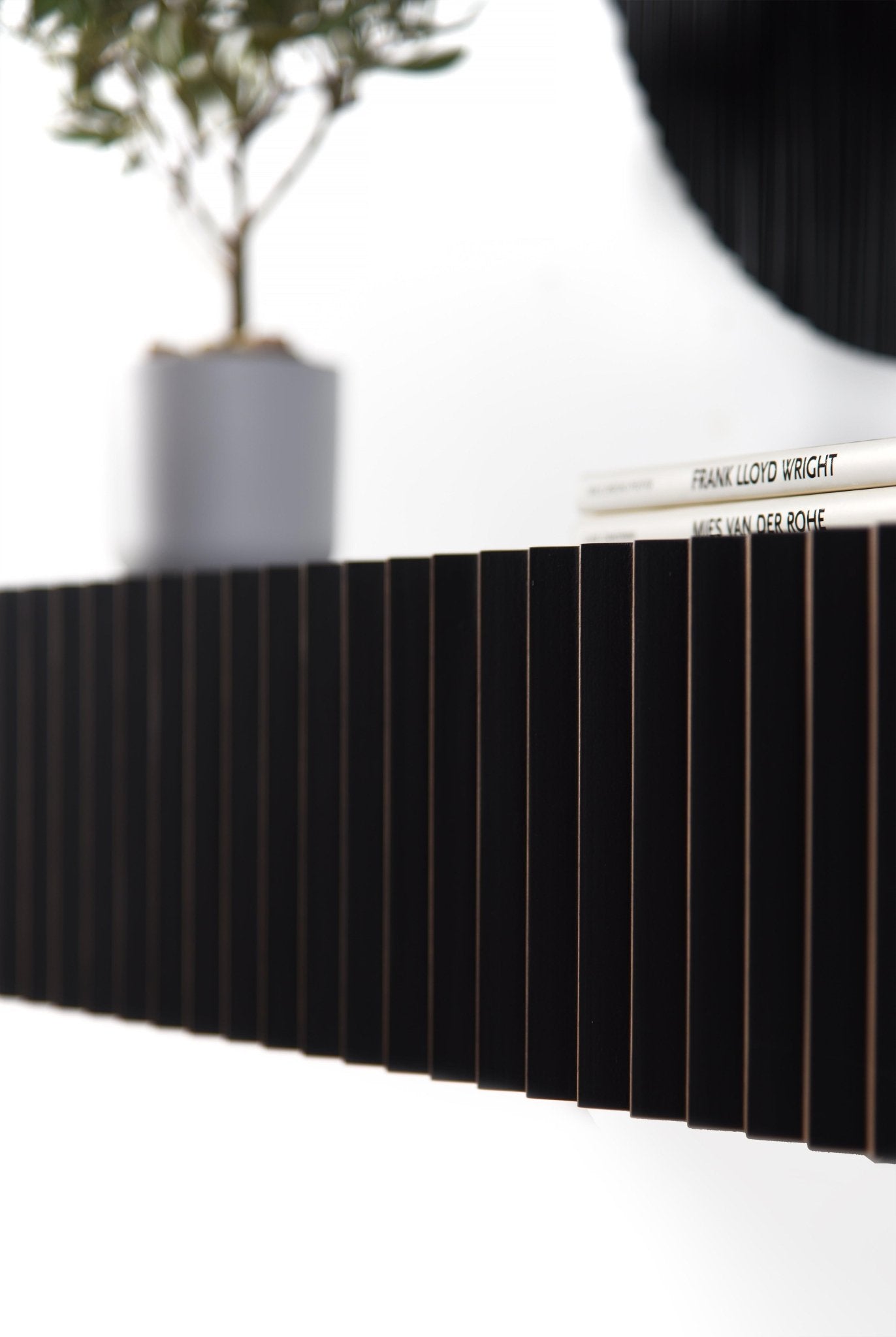 Side profile detail of the black console front showing depth and clean finishing