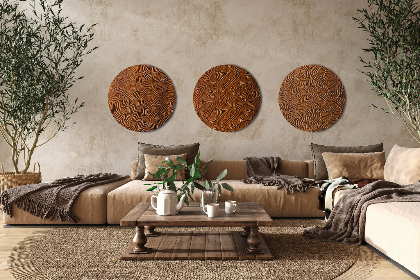 Three round iroko wall sculptures from the Wind And Earth set, styled in a warm minimalist living room