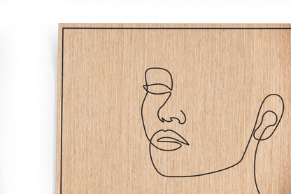 Close up of the carved facial line detail on the oak surface