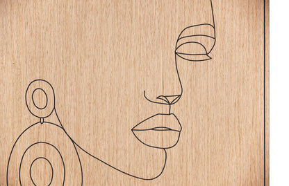 Close up of the carved line portrait on oak showing the earring and facial profile detail