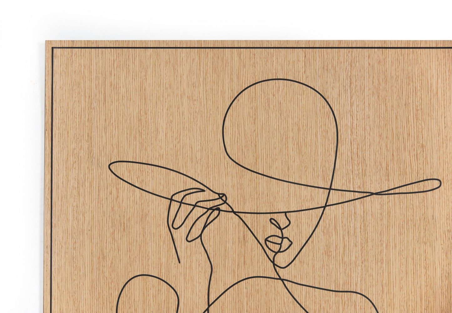 Woman with Hat carved oak wall art displayed in a calm modern living corner