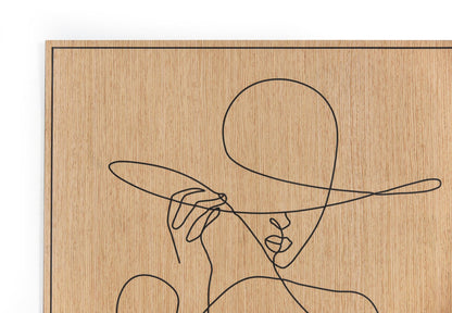 Woman with Hat carved oak wall art displayed in a calm modern living corner