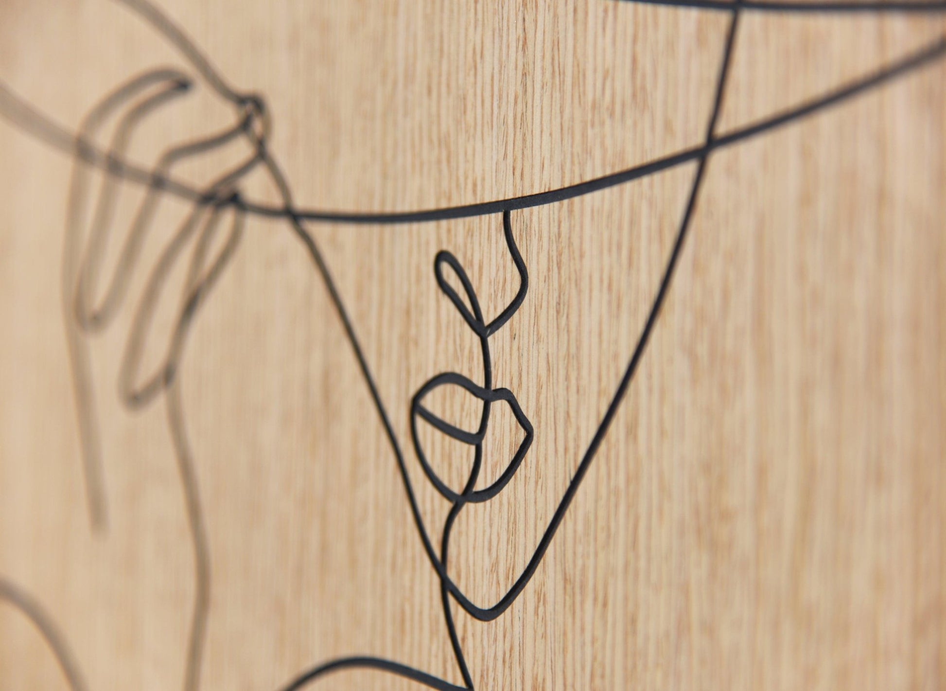 Minimal line portrait carved on oak, Woman with Hat wall art styled in a bright interior